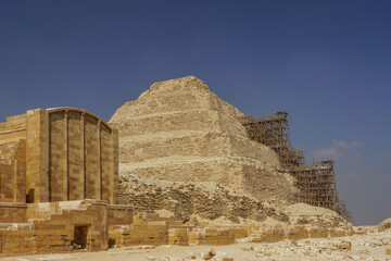 Fototapeta na wymiar Saqqara, Egypt: The funerary complex of Djoser and the step pyramid, undergoing renovation.