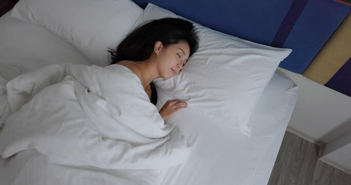 Woman sleep on bed at bedroom