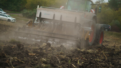 Tractor working in the field. Autumn tillage. Deep ripping with powerful tractor