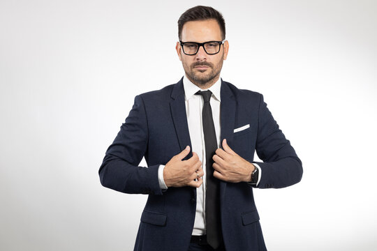Business man formaly dressed, picture taken on white background. Studio portrait