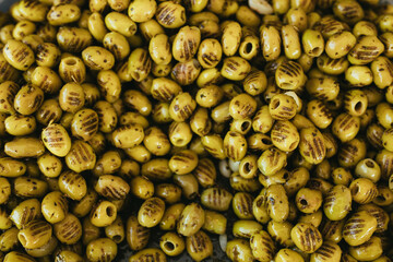 Green olives close up background.