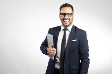 Studio portrait of young, happy business man. White background studio portrait. Isolated background