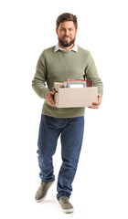 Fired young man holding box with personal stuff on white background