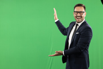 Young formal dressed buisness man, showing different emotions on green screen, green background.