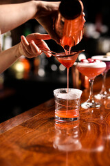 bartender pouring cocktail