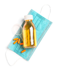 Cough syrup, pills for sore throat and medical mask on white background