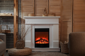 Modern electric fireplace in interior of dark living room