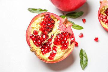 Half of fresh pomegranate on white background