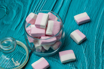 Heap of pink marshmallows in a jar