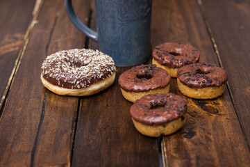 Chocolates covered donuts and cup of choco milk