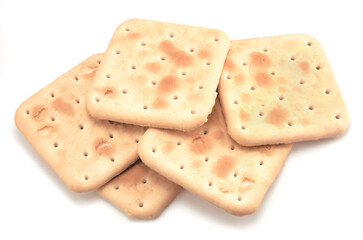 Soda cracker stack closeup, large detailed isolated square crisp whole grain saltine crackers macro closeup, military field ration MRE concept, gentle shadows, perforations, saltines flat lay detail