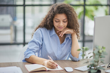 Business woman working at office with documents on his desk