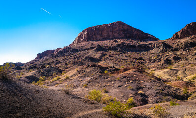 Sara Mountain Park trails arid desert landscape with red rock sandstone formation in Lake Havasu City, Arizona