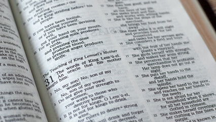 King Lemuel's mother advice for wisdom verses in open Holy Bible. A close-up. Christian Old...