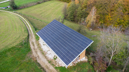 solar panels on the roof of a farm warehouse