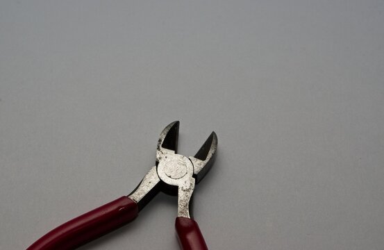 Pair of side cutter pliers on a white background