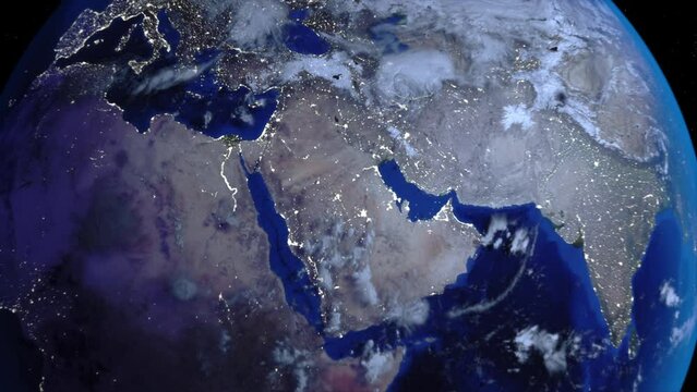 Zoom out of Middle East through clouds to see the Earth from space.