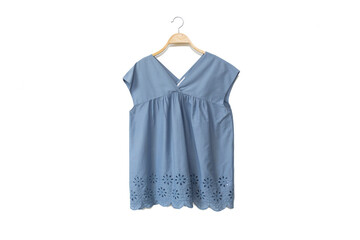 Blue colour blouse is clothes hanger on white background.