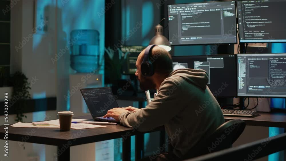 Poster silly web developer playing air drums and listening to music on headset, enjoying song and working o