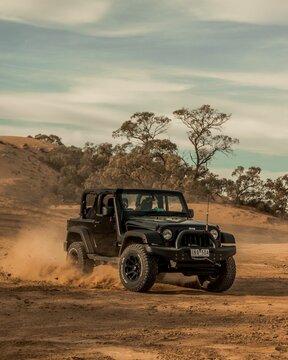 Vertical shot of a Jeep wrangler off-road on sands in Mildura, Australia