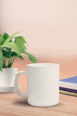 Blank white mug or cup on office desk