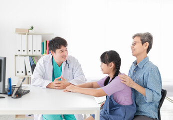 asian doctor diagnosis and explaning to child patient about disease symptoms, treatment process in hospotal