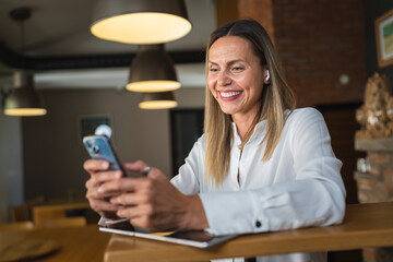 Obraz na płótnie Canvas One caucasian woman adult entrepreneur using mobile phone at work