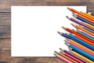 Obraz premium Colored drawing pencil and white paper