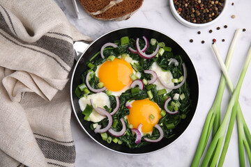 Flat lay composition with tasty Shakshouka and ingredients on white marble table