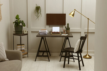 Writer's workplace with typewriter on dark table desk in room