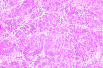 Defocus blurred transparent purple colored clear calm water surface texture with splashes and bubbles. Trendy abstract nature background. Water waves in sunlight with copy space. Pink watercolor shine