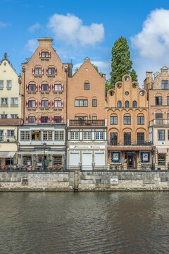 Beautiful shot of the beautiful old town buildings at the river in Gdansk, Poland