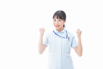 ガッツポーズをする若い看護師