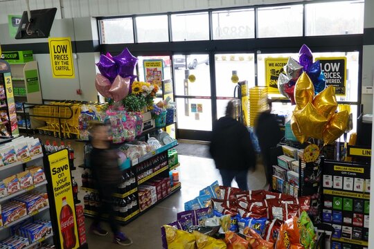 Dollar General store with customers exiting after checking out