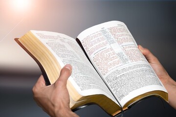 Christian concept. Young person reading Holly Bible book