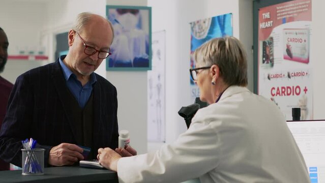 Diverse people buying pharmaceutical products at cash register, paying with smartwatch, mobile phone with nfc and credit card. Customers having pills and medicaments at counter.