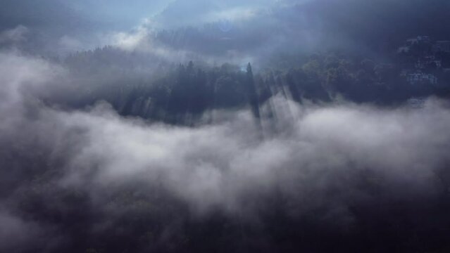 Areal drone footage from Karpenisi area, into the mountains and lake.