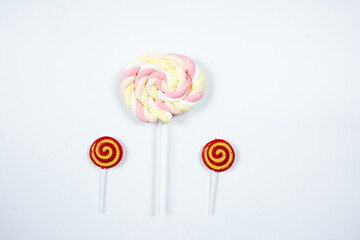 Colorful lollipops upon a white background