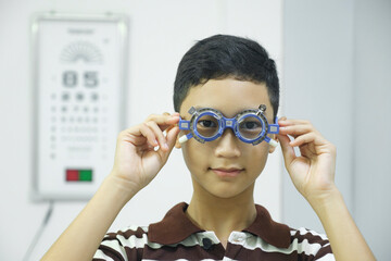 Man examining eyesight in optical clinic.