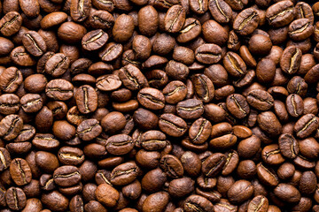 Roasted coffee beans top view, closeup image, space for text