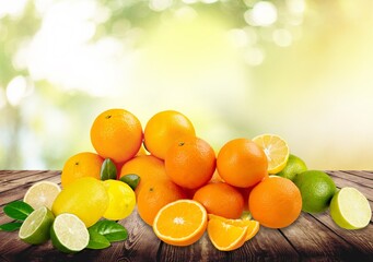 Fresh juicy citrus fruits on wooden desk
