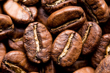 Roasted coffee beans top view, closeup image, space for text