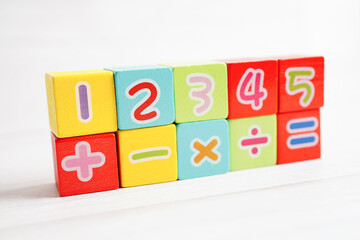 Number wood block cubes for learning Mathematic, education math concept.