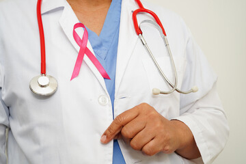 Asian woman doctor with pink ribbon, World Breast Cancer Day at October.