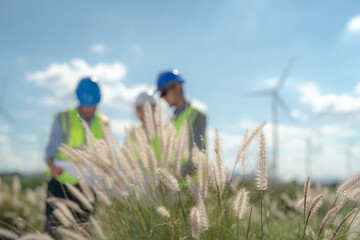 Asian engineer working in fieldwork outdoor. Workers check and inspect construction and machine...