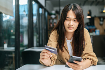 Young businesswoman paying order having contactless payment with cardit card