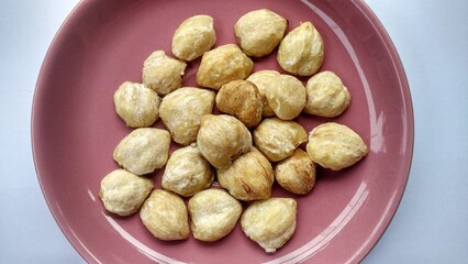 Aleurites moluccana L. Wild Pecan Seeds. source of oil and spices for cooking seasoning. Known as candleberry, Indian walnut, and candlenut.