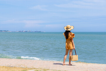 Tourist woman in the sand beach