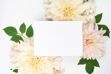 Deurstickers White and blush fresh dahlia blooms and blank stationery card flat lay © IlzeLuceroPhoto