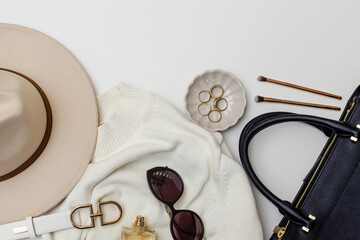 Flat lay with stylish feminine accessories on the white background.